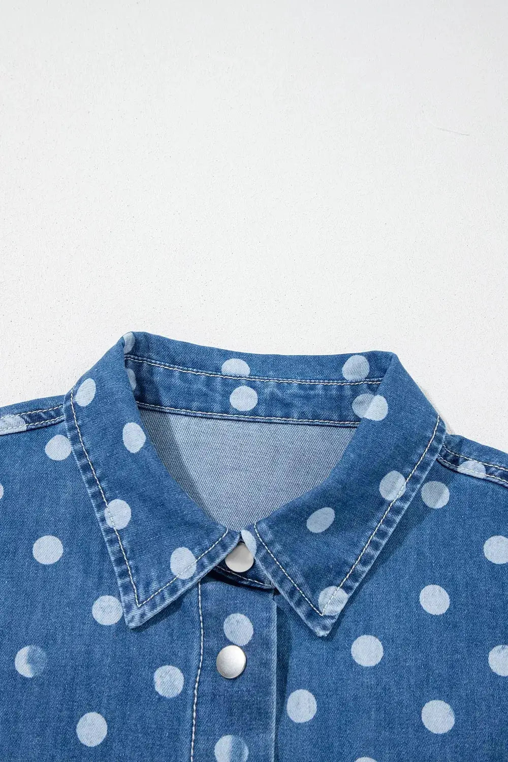 Polka dot denim shirt with button closure and classic collar, blue with white dots