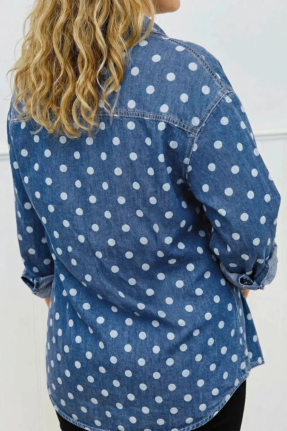 Polka dot blue denim shirt jacket with long sleeves and rolled cuffs