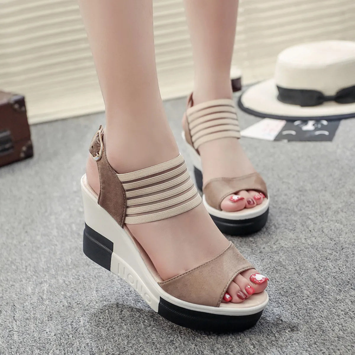Pair of beige suede and elastic-strap platform wedge sandals with ankle buckle