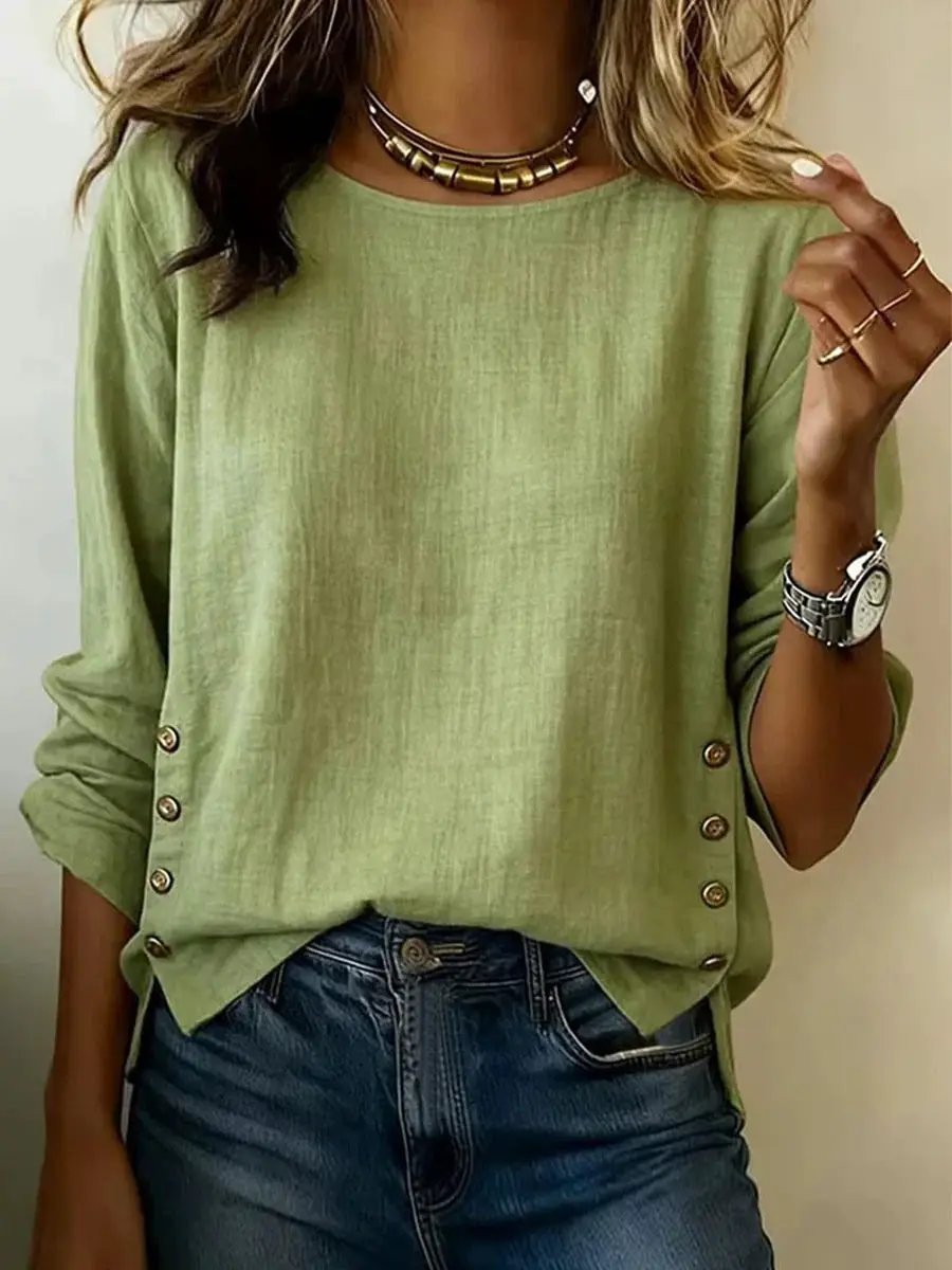 Breathable linen short-sleeve crew-neck T-shirt in light green with rolled sleeves and side button accents