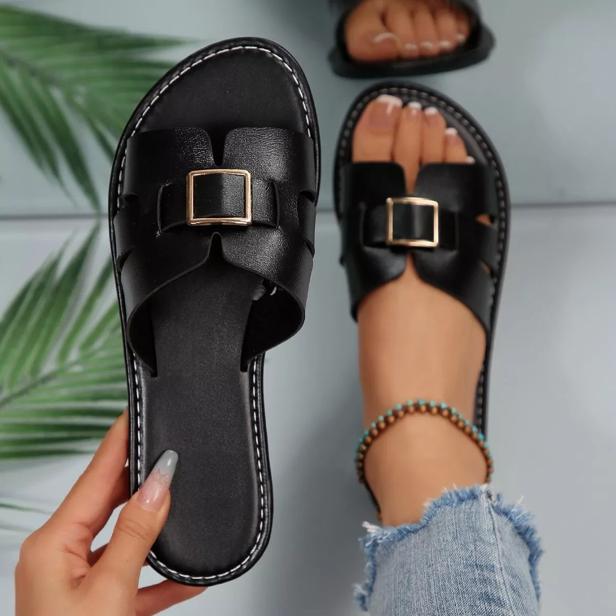 Elegant Buckle Slide Sandals by Trendsi, black faux leather with gold buckle, two sandals shown.