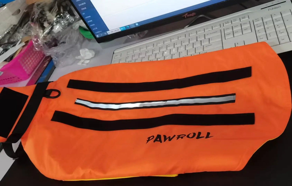 Paw Roll developing product orange safety vest by AdTec with black reflective stripes