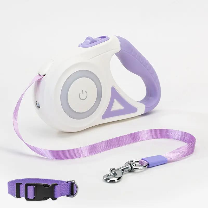 Retractable dog leash with purple handle and white body, metal clasp.