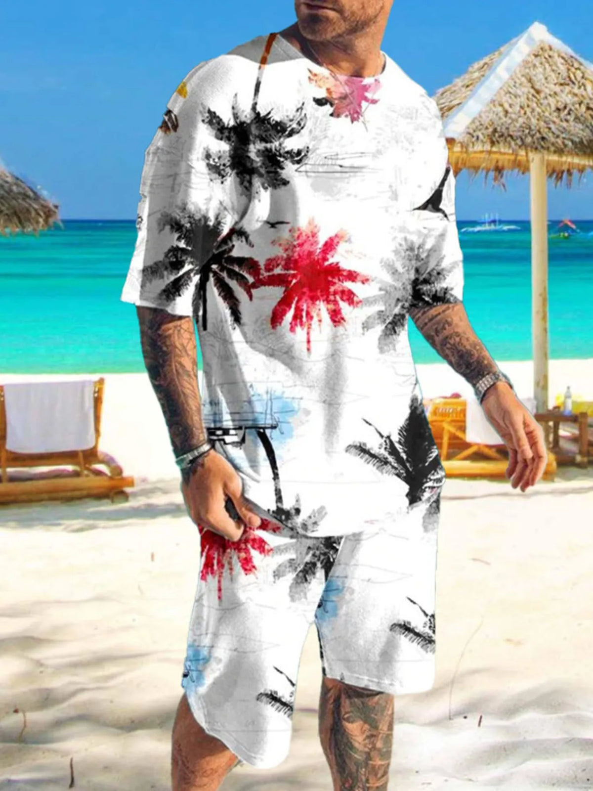 Mens two-piece printed tropical tee and shorts set; white base with black and red palm tree prints