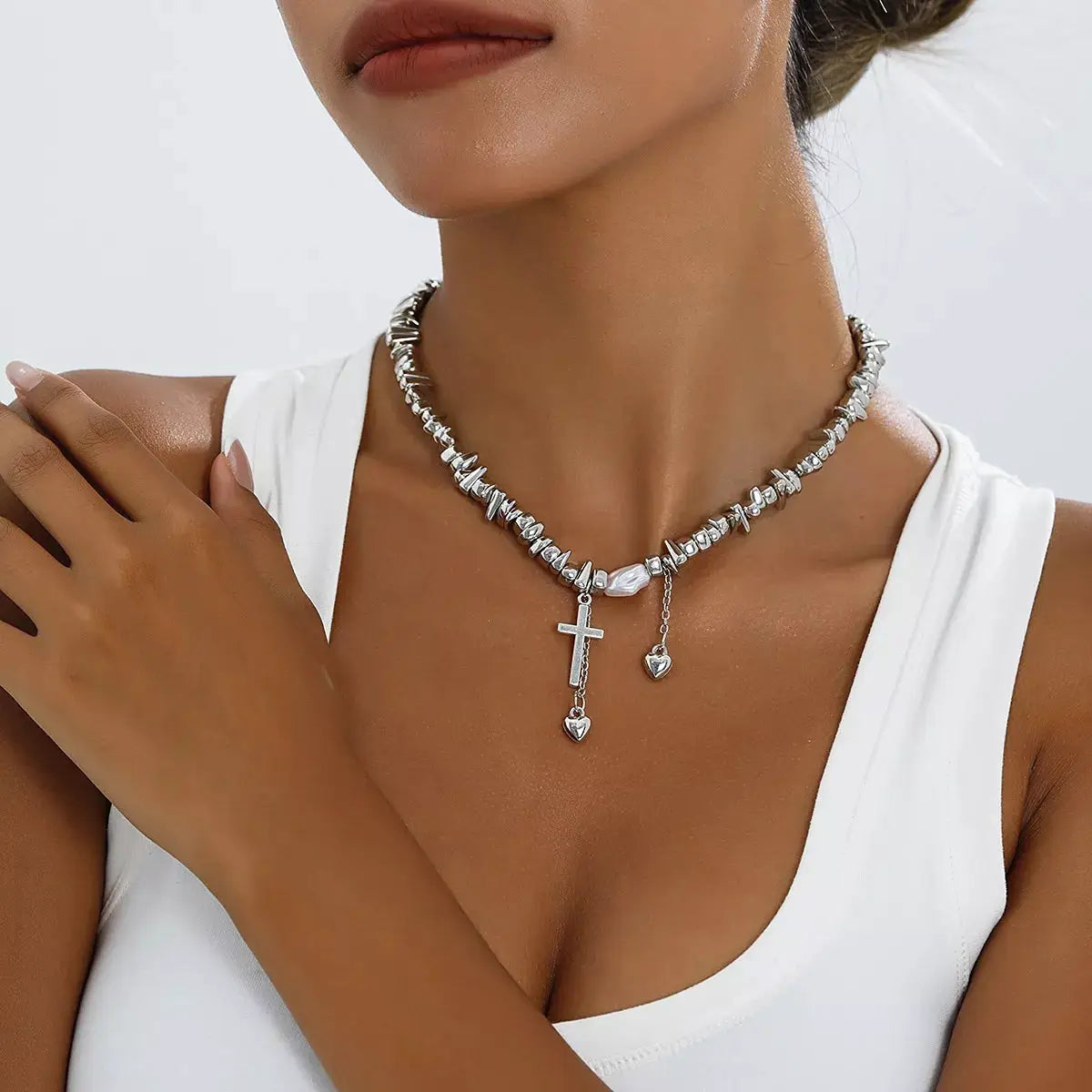 Chunky chain cross pendant necklace in silver-tone with two heart charms