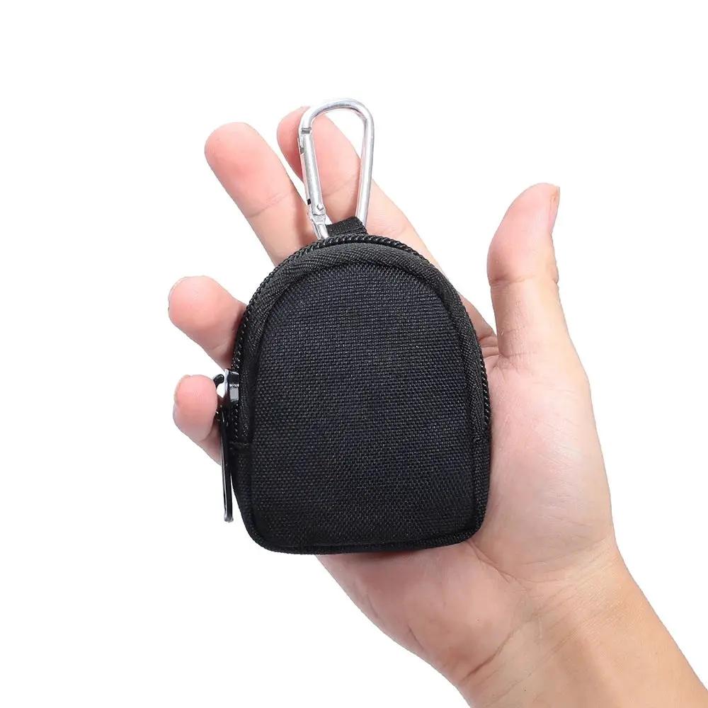 AdTec mini black zippered pouch with carabiner clip, held in hand