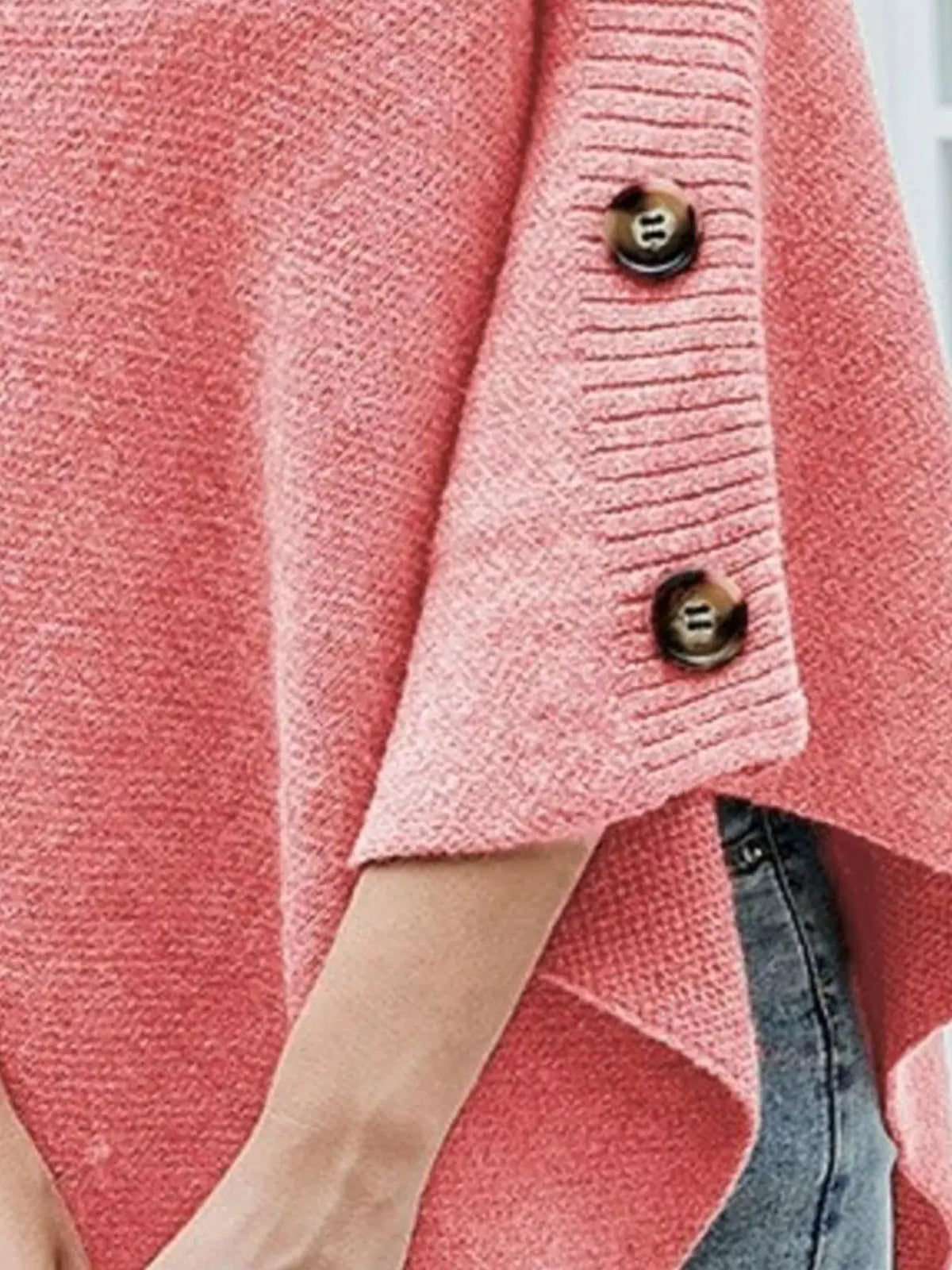 Button turtleneck poncho pullover in pink knit with brown button placket