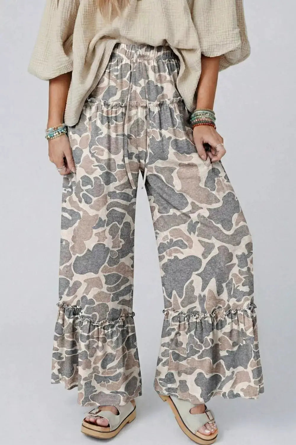 Camo print ruffle-hem wide-leg pants by Trendsi, beige-gray camouflage.