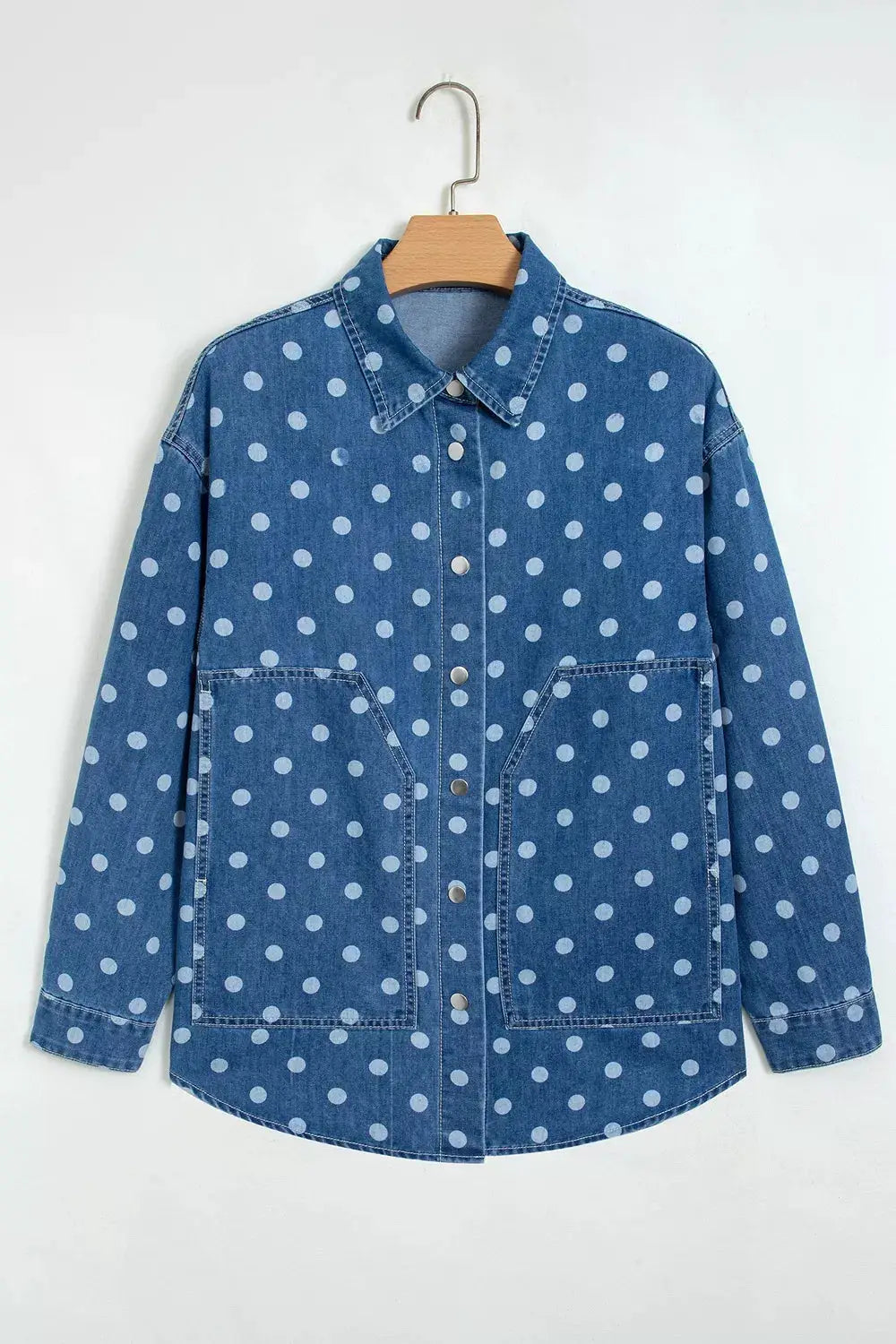 Polka dot blue denim tunic jacket with long sleeves and front pockets, button closure