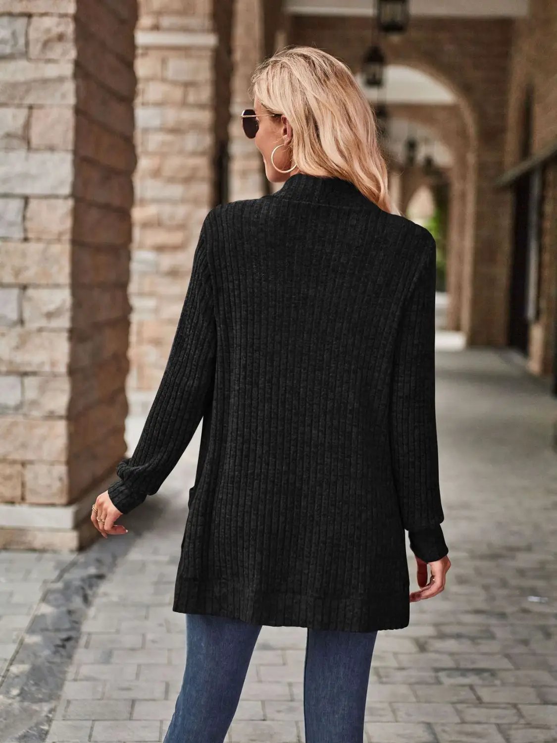 Women's stretchy black ribbed knit open-front cardigan with deep side pockets
