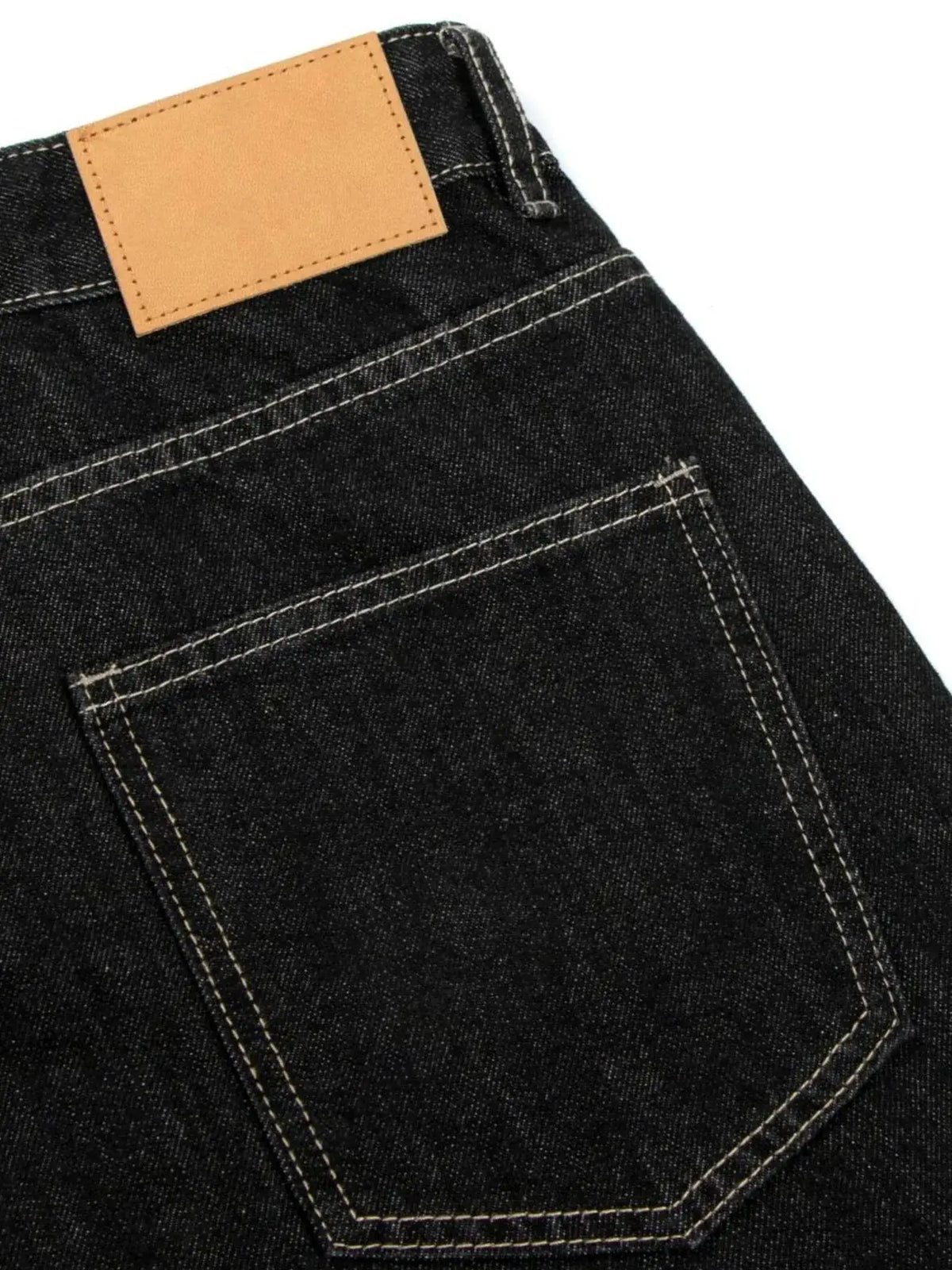 Men's denim shorts, dark indigo cotton-stretch with tan leather patch and back pocket