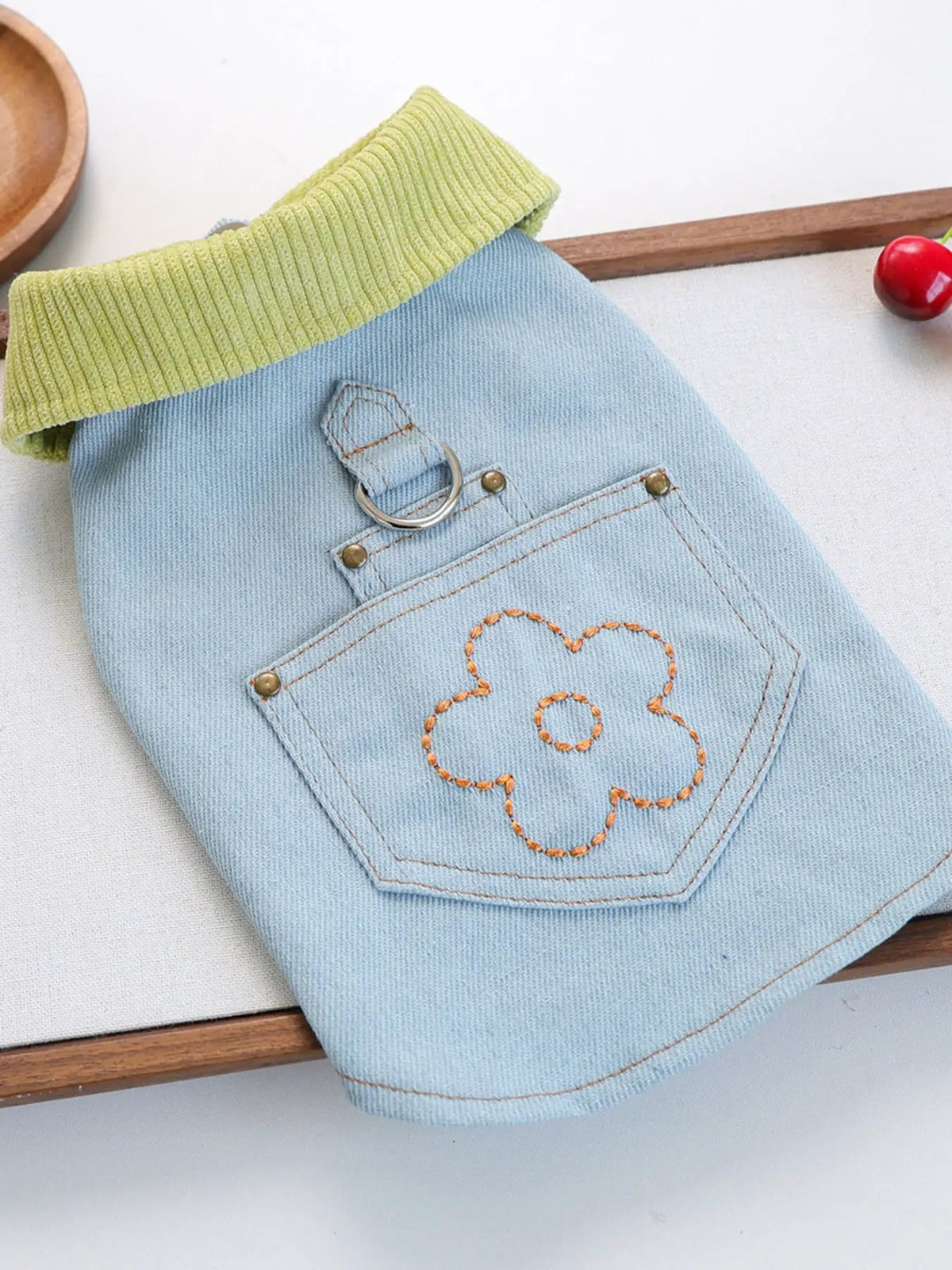 Denim pet top with lime-green ribbed collar and orange flower embroidery; Trendsi.
