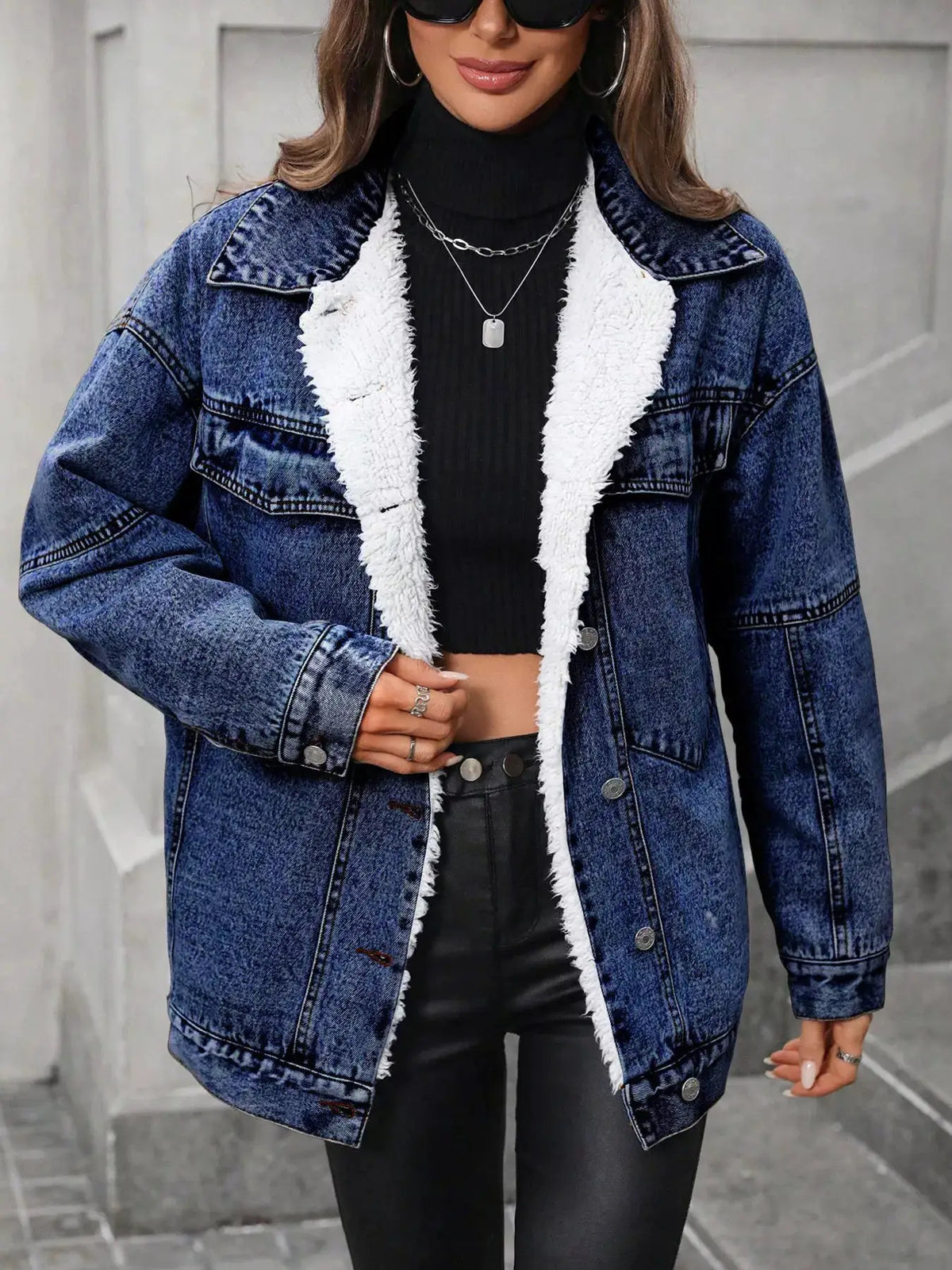 Womens sherpa-lined denim jacket with white faux shearling trim, blue denim, button-up style