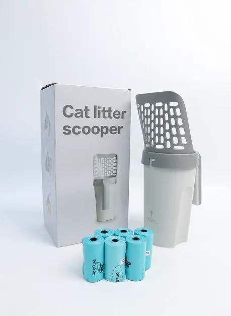 AdTec cat litter scooper with integrated white bucket and gray scoop, blue liner rolls beside the box