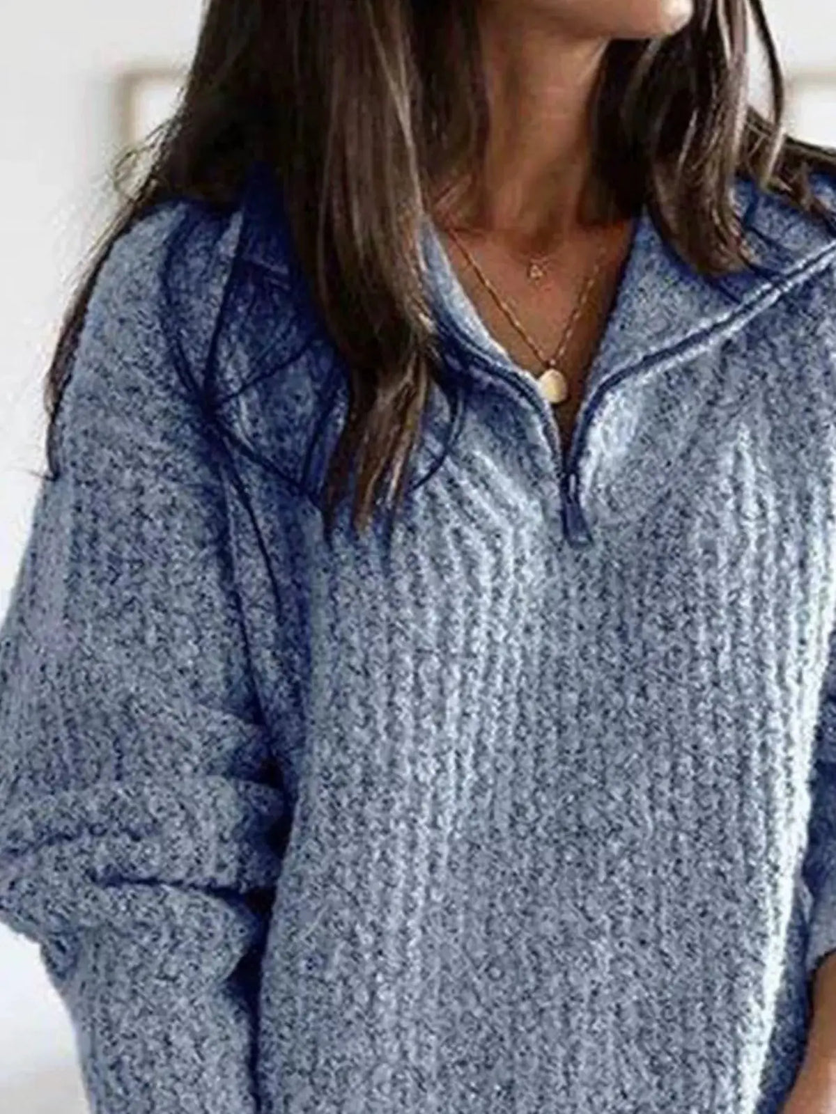 Plus-size textured blue knit half-zip sweater with chunky rib detail