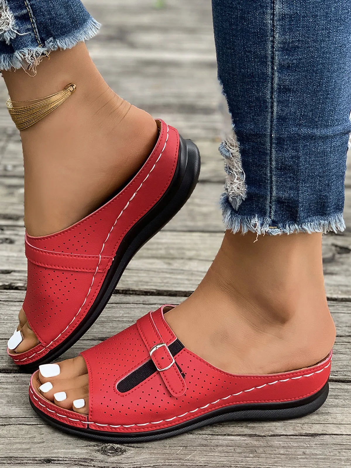 Casual Comfort Buckle Strap Sandals pair, red perforated upper with white stitching, black sole.