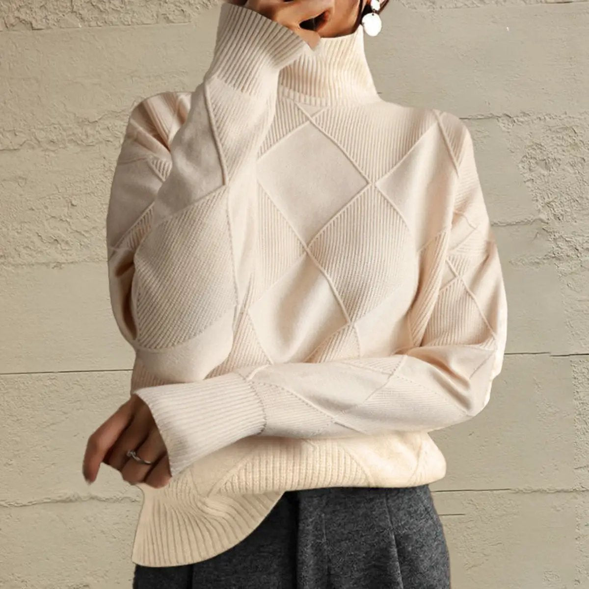 Geometric turtleneck long-sleeve sweater in cream stretch knit with diamond argyle pattern