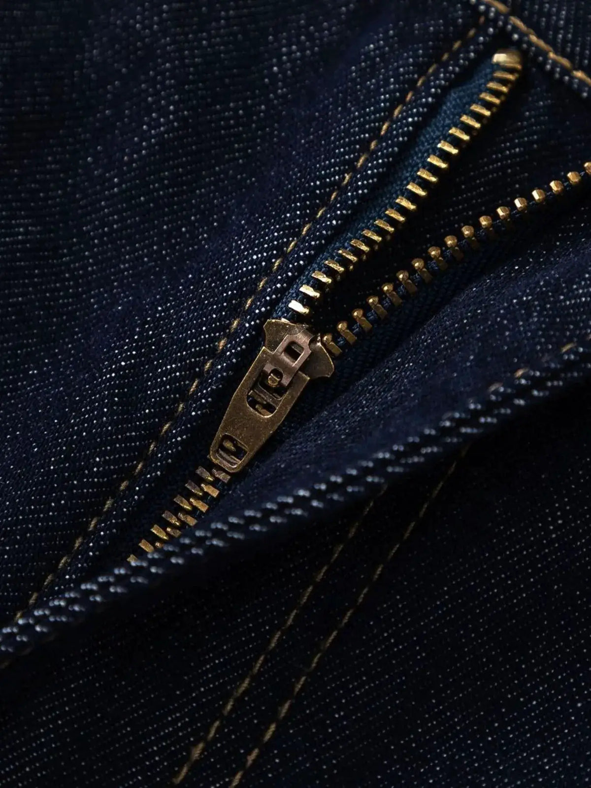 Men's wide-leg denim shorts in dark blue cotton denim with brass zipper detail
