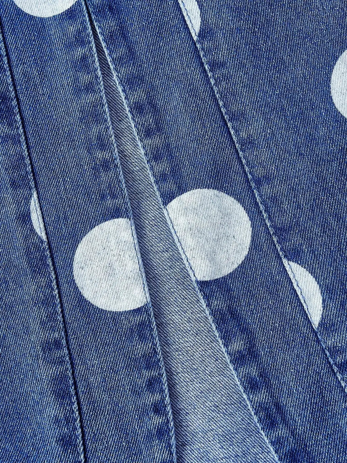Womens cropped denim jacket with white polka dots on blue indigo denim fabric