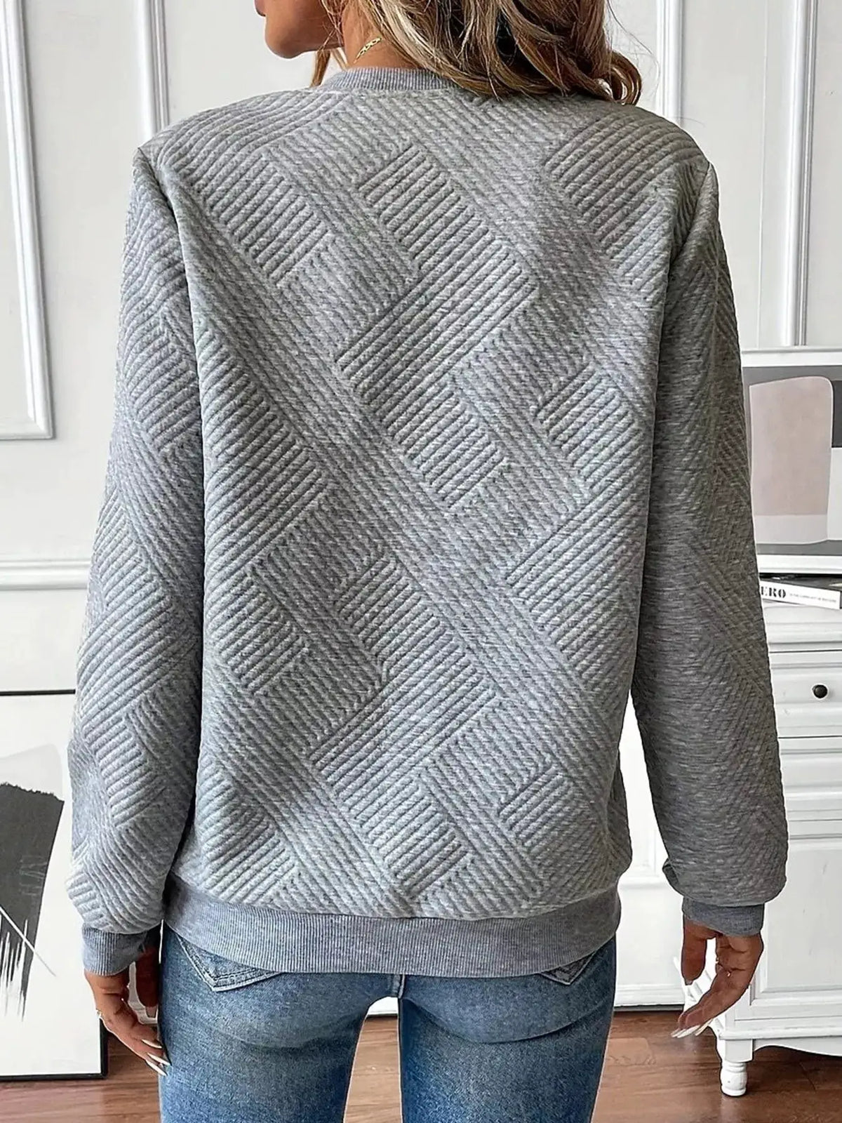 Textured quarter-zip sweatshirt in heather gray with diagonal ribbed pattern.