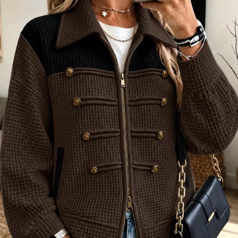 Lady's jacket in brown quilted fabric with black yoke, gold buttons and center zipper.
