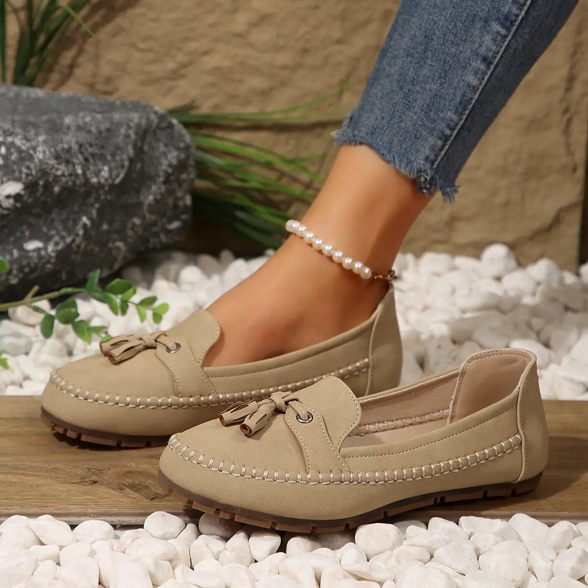 AdTec women's round-head loafers in beige suede with tassels and non-slip sole; two shoes shown.