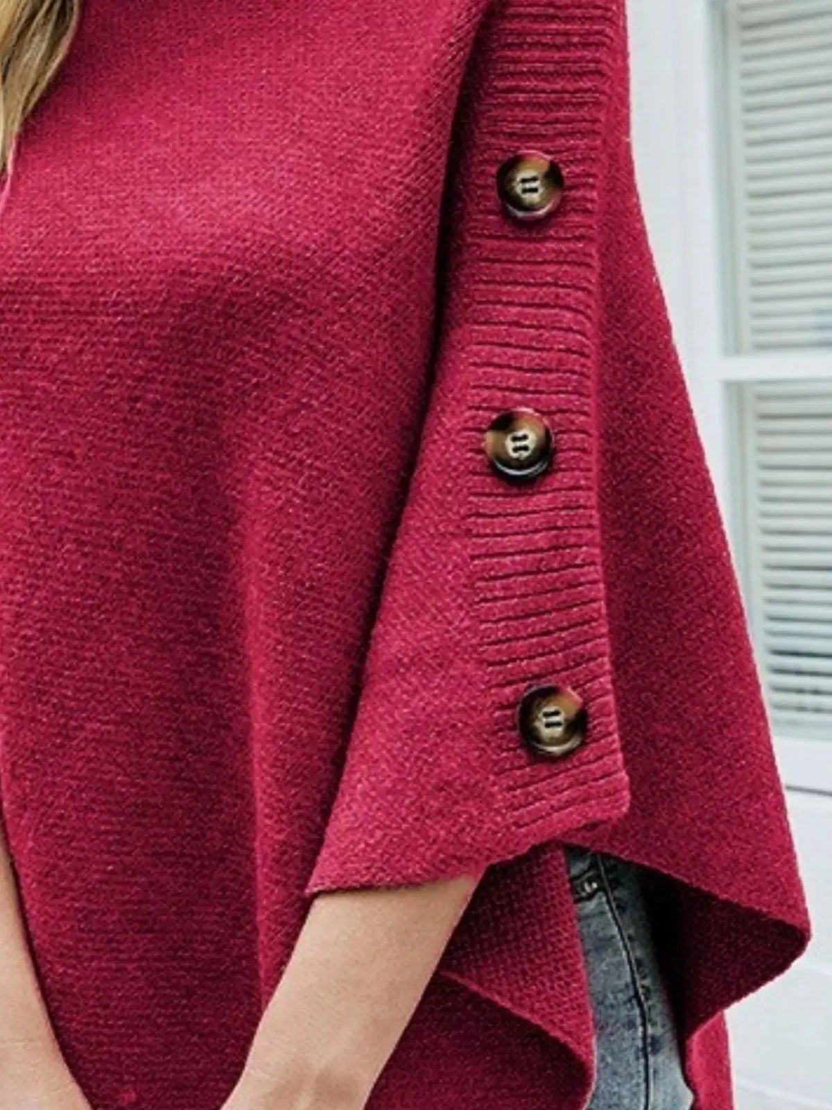 Red knit buttoned turtleneck poncho pullover with ribbed sleeve detail
