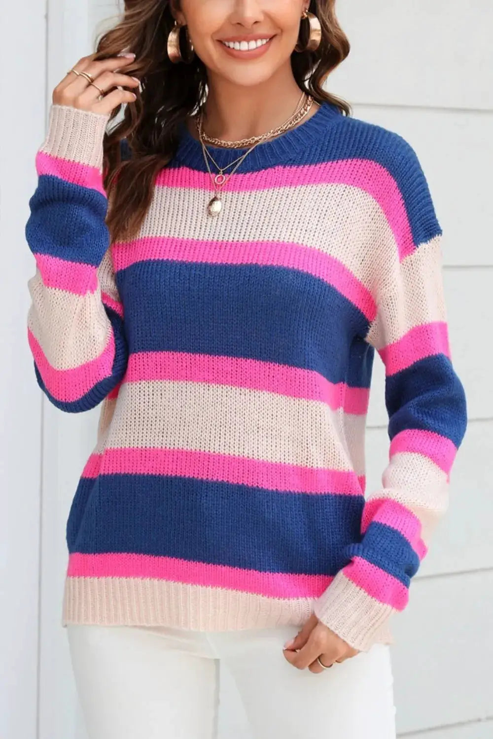 Angel Wings color-block knit sweater; blue, pink and beige stripes, round neck, dropped shoulders.