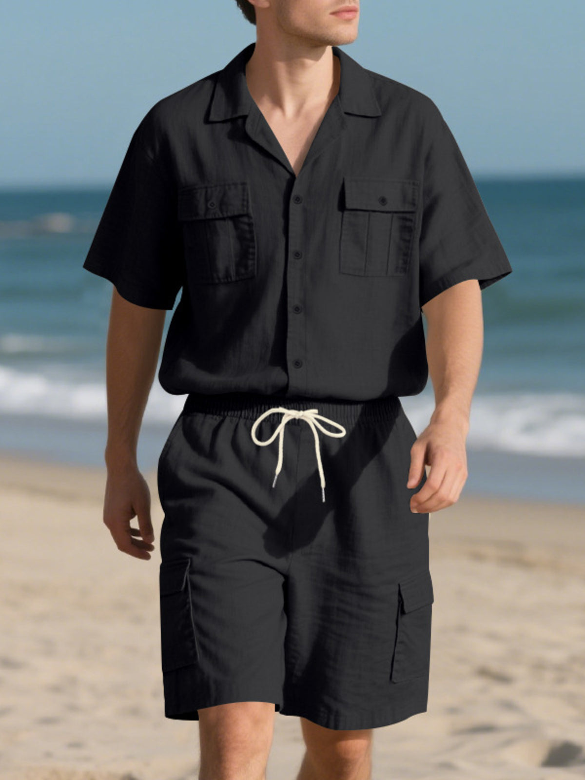 Men's full-size black button-up shirt and shorts set; pocketed short-sleeve shirt and drawstring shorts.