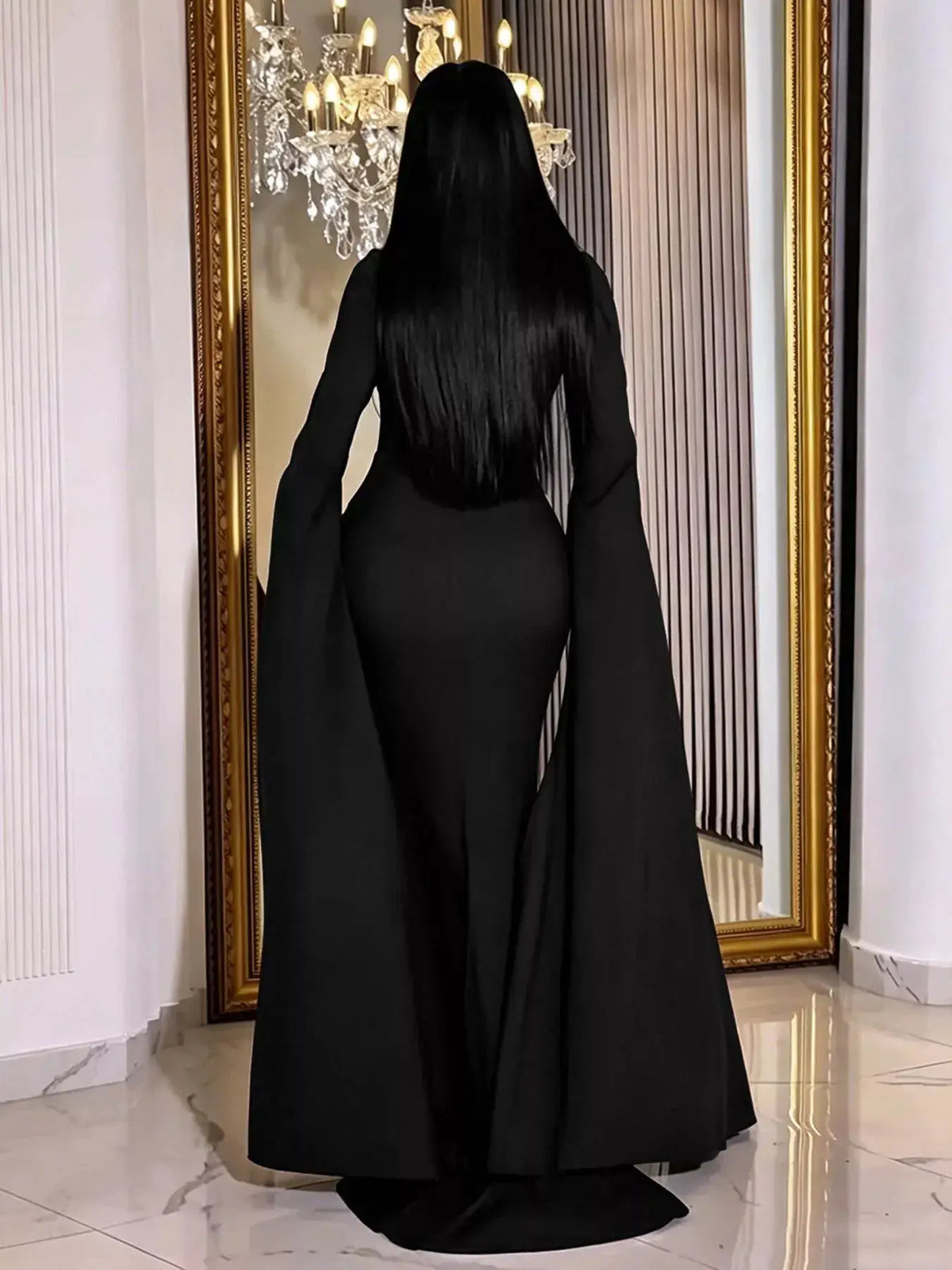Rhinestone Slit Flare Sleeve Cape Maxi Dress in black by Trendsi, back view