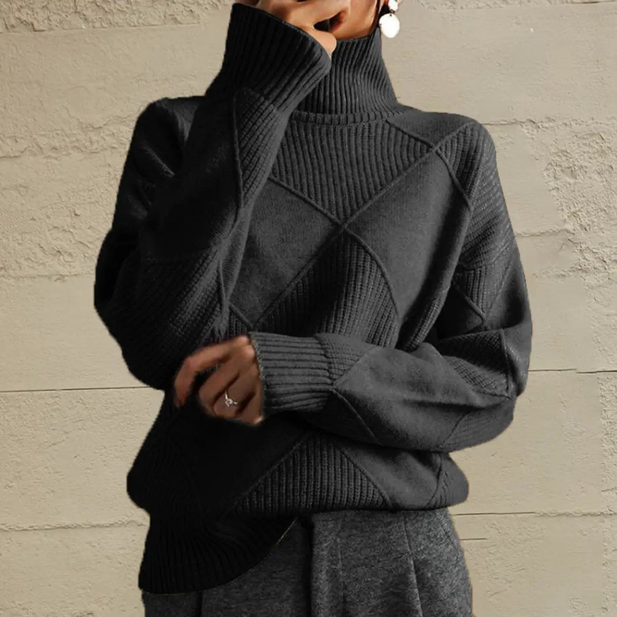 Geometric turtleneck long sleeve sweater in black with stretch knit fabric.