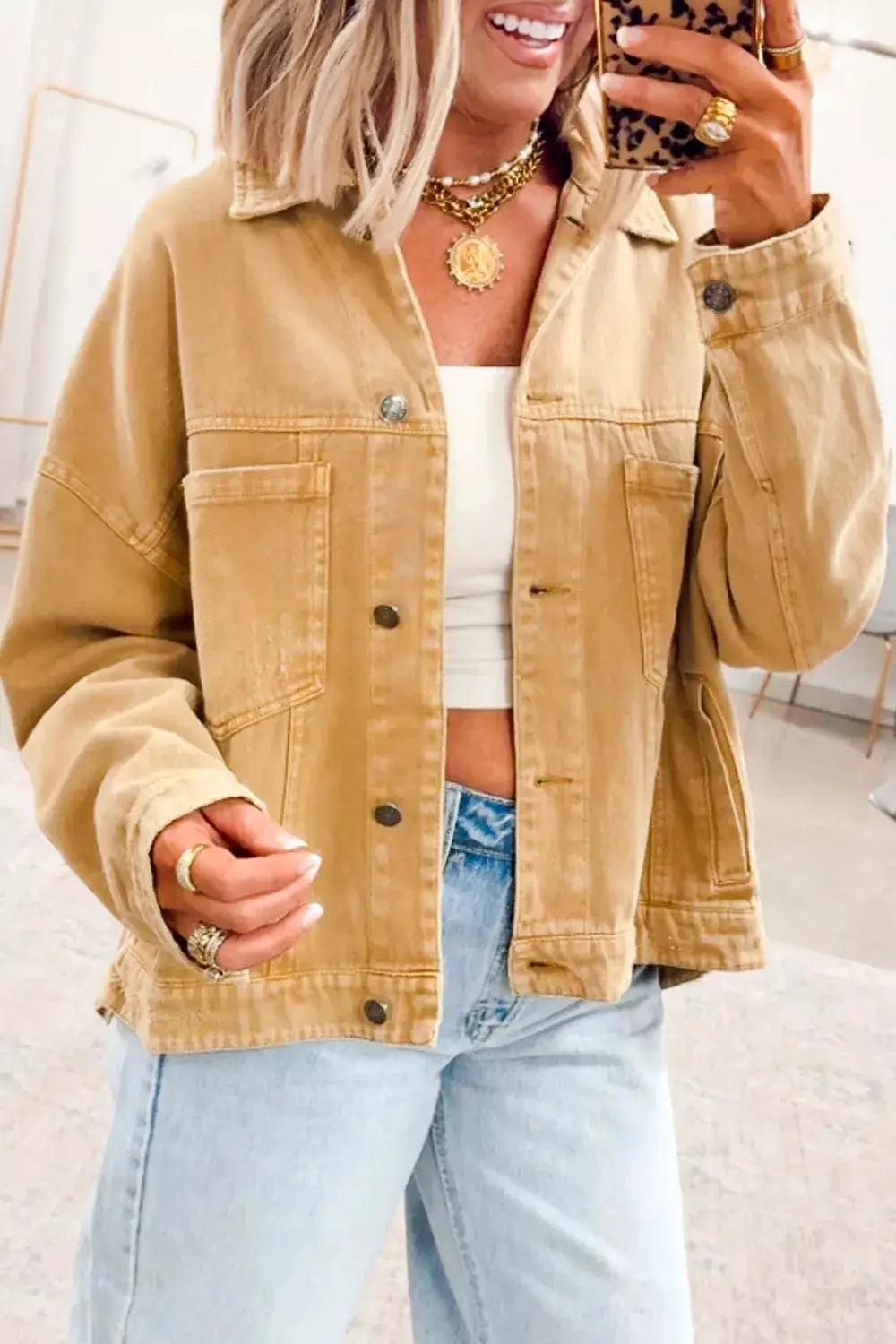 Washed tan trucker denim jacket with metal front buttons, cotton blend