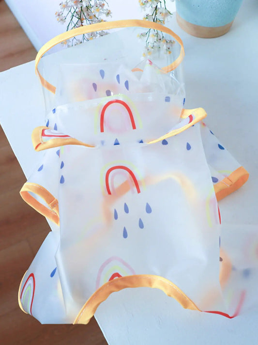 Lightweight Waterproof Pet Raincoat, translucent with rainbow arches and blue raindrops, orange trim