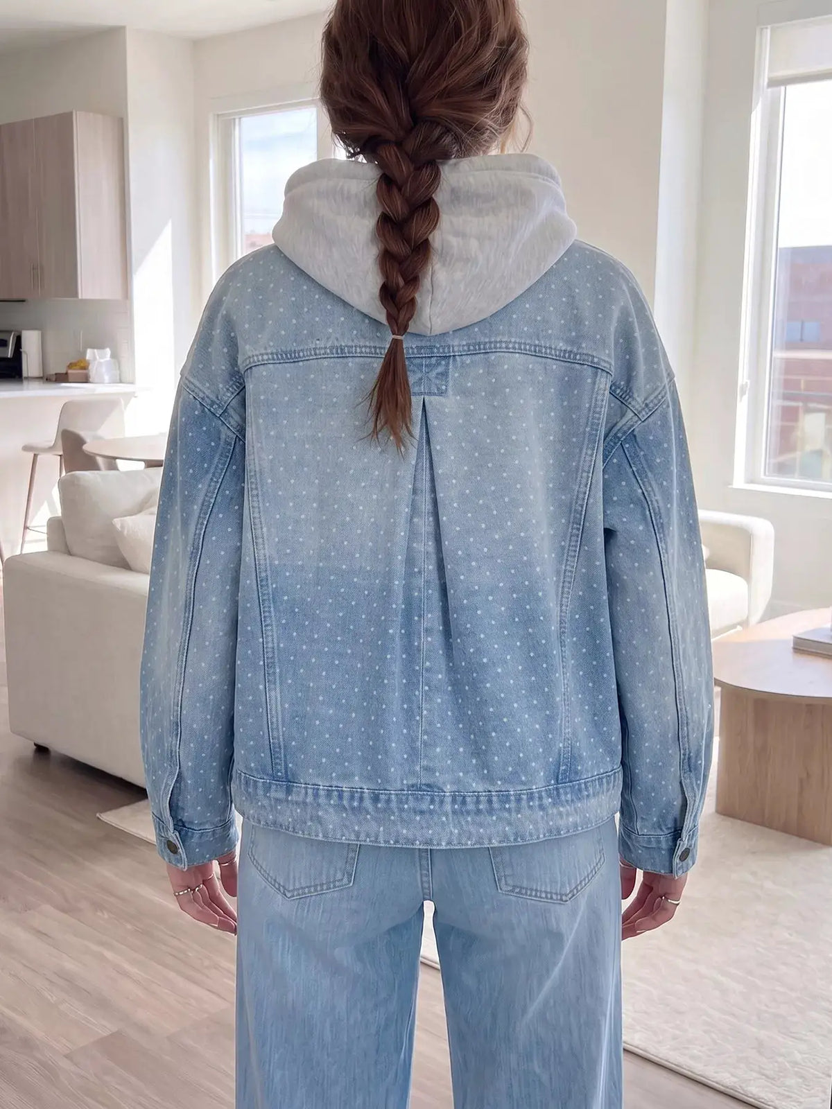 Polka dot denim jacket with pockets; light blue denim with white polka dots and back pleat detail