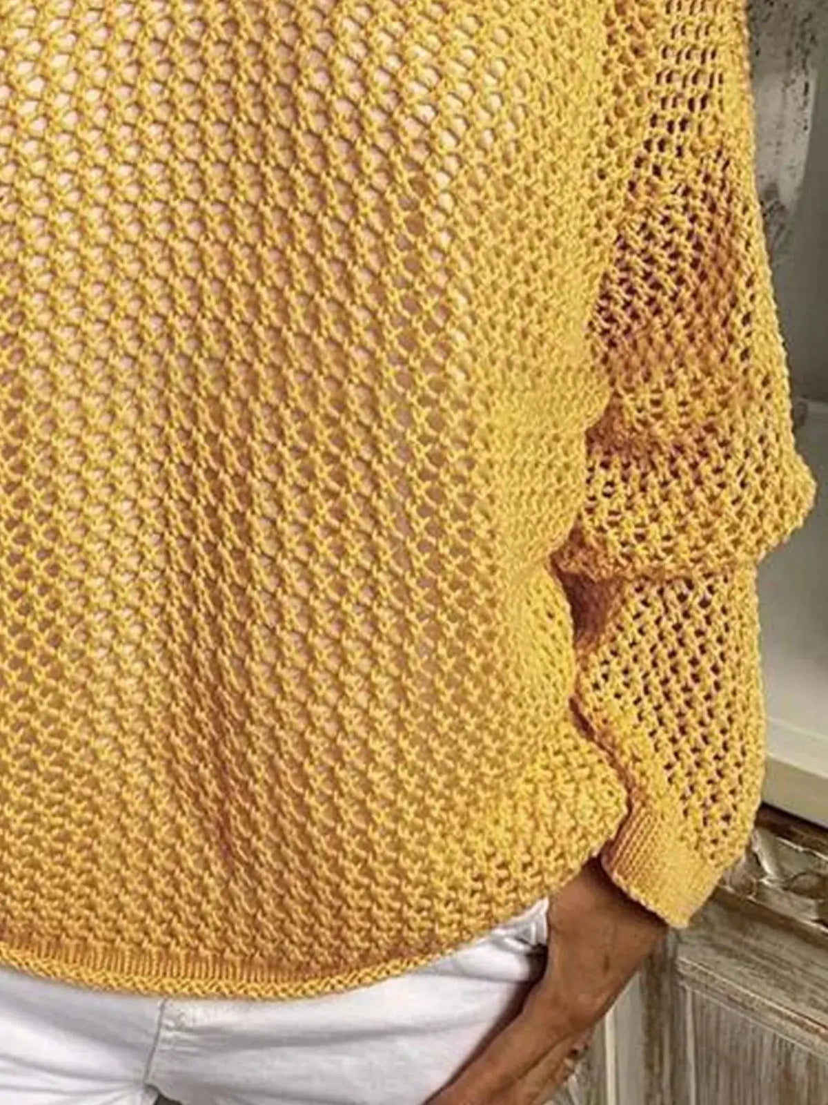 Openwork long-sleeve hooded knit beach cover-up in mustard yellow.