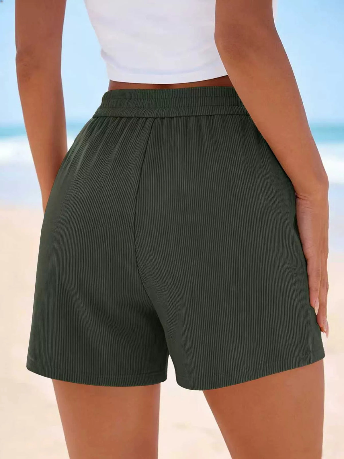High-Waisted Shorts in dark green ribbed fabric from Trendsi, a versatile beach-ready wardrobe essential
