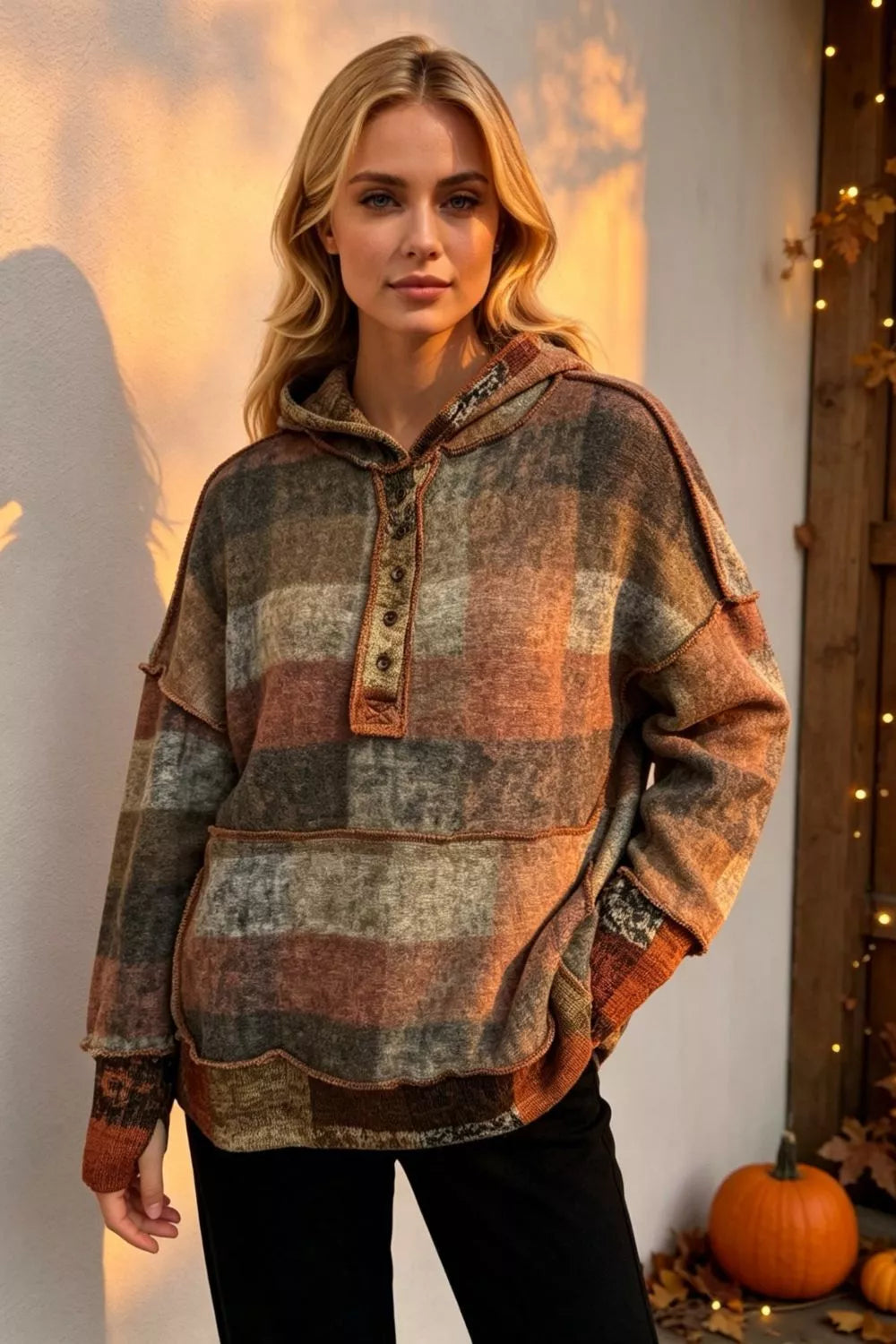 Plus-size plaid fleece hoodie by Trendsi with dropped-shoulders in warm orange-brown-gray tones