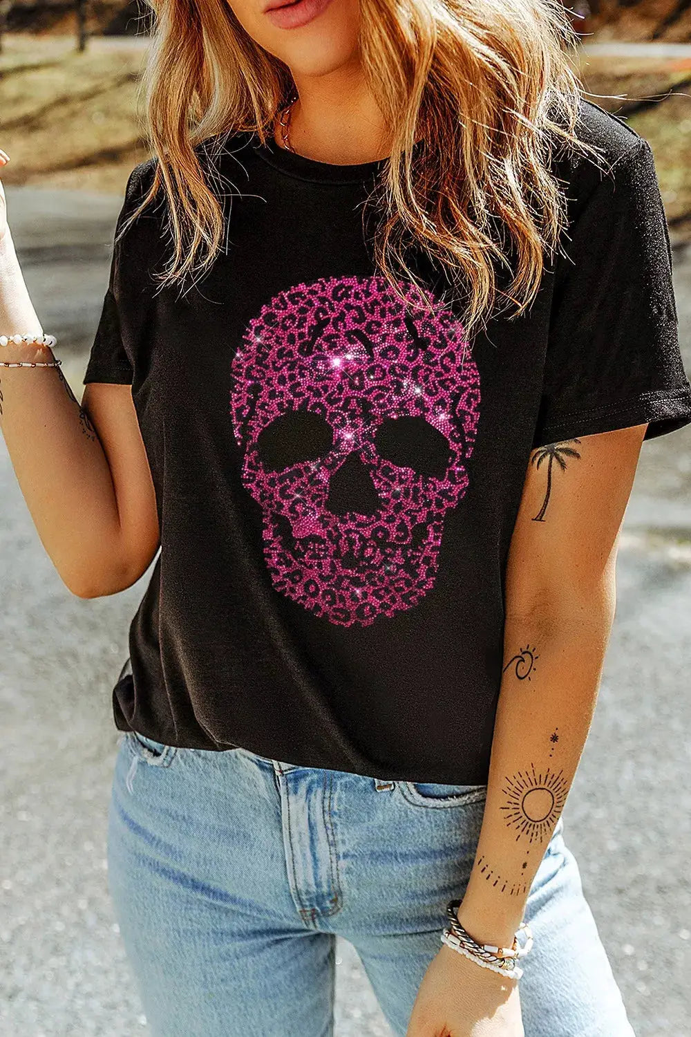 Rhinestone Skull graphic crew neck t-shirt by Trendsi; black with pink rhinestone skull design.