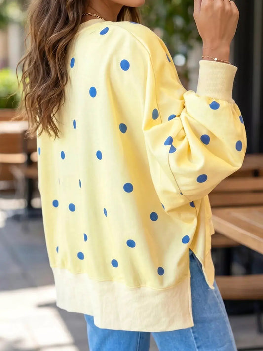 Side Slit Polka Dot Oversized Sweatshirt in pale yellow with blue dots and puff sleeves