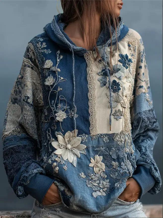 Plus-size hoodie with blue denim patchwork and floral embroidery, relaxed fit with drawstring hood and front pocket
