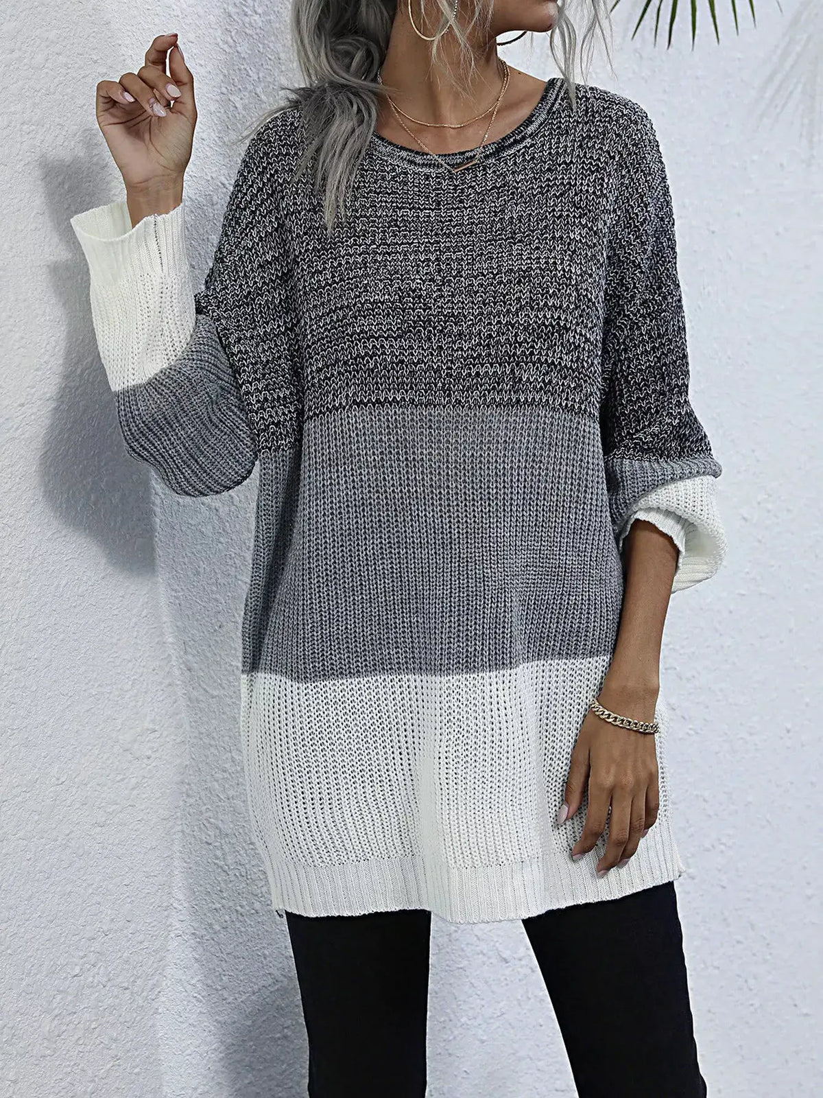 Color-block oversized knit sweater with round neck; dark gray, light gray, and white blocks, relaxed fit.