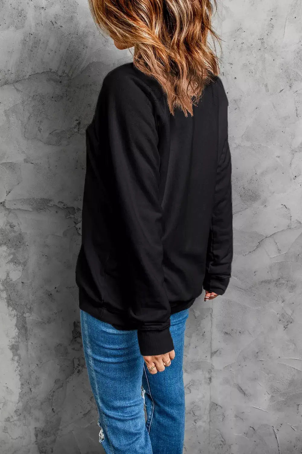 Spooky Rhinestone Drop Shoulder Sweatshirt, black, back view of model.