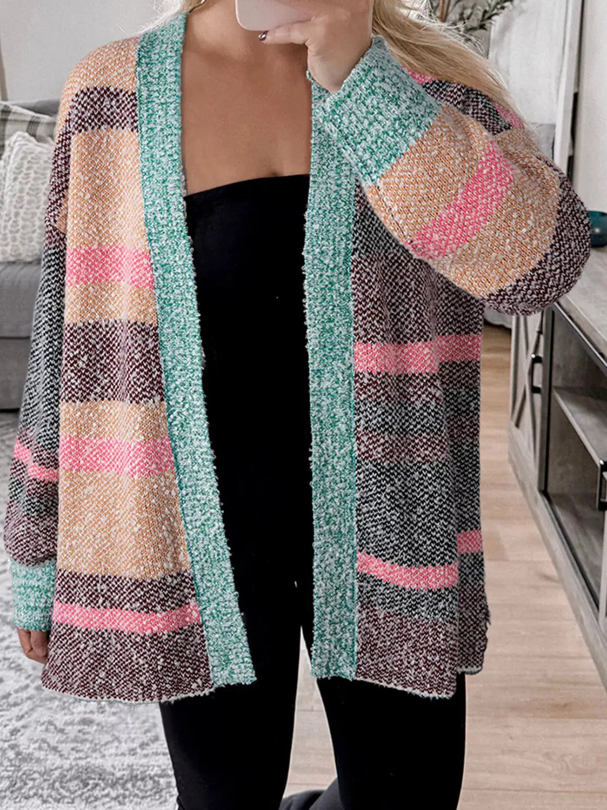 Cardigan, multi-color striped pattern in soft stretch knit with teal front trim, open-front longline style.