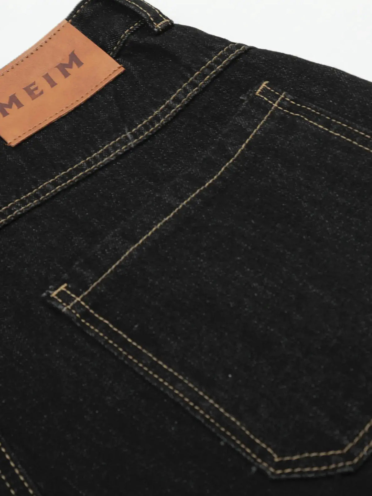 Mens wide-leg cotton denim shorts in dark denim with breathable contrast stitching and leather patch label