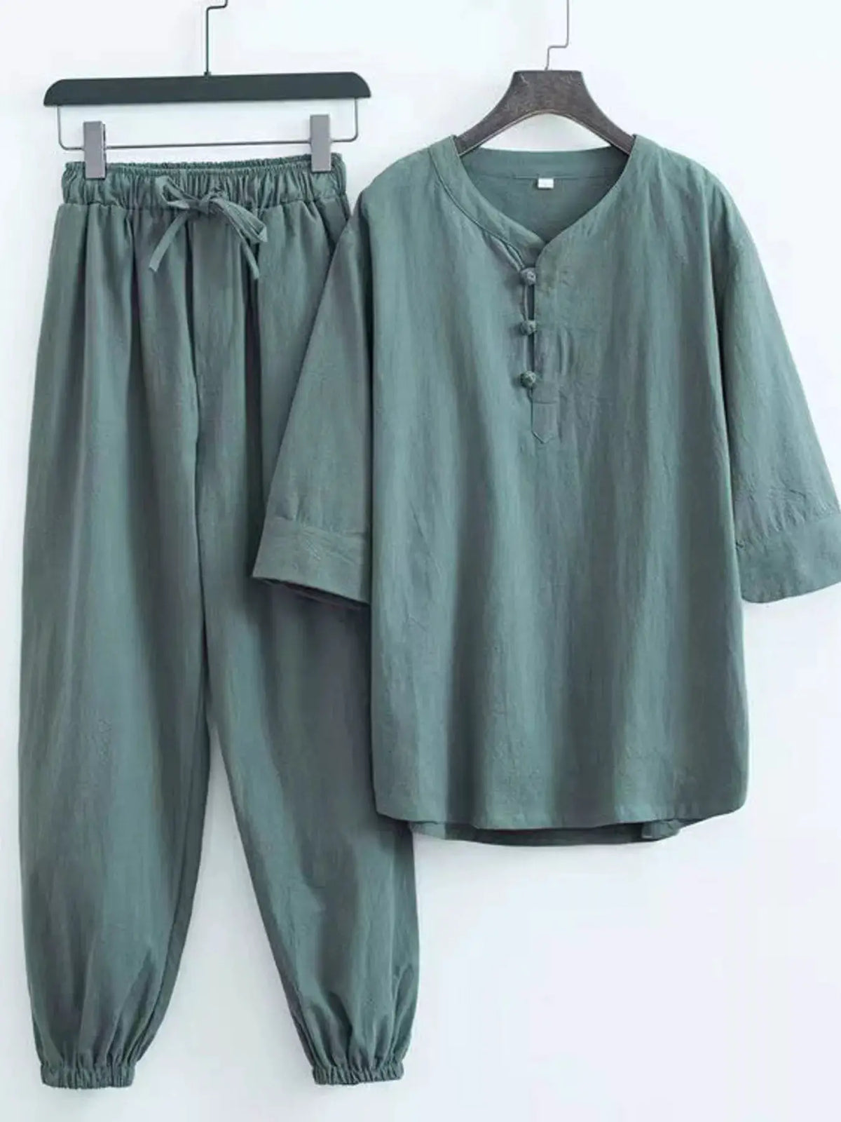 Men's plus-size Chinese-style pajama set, 2-piece teal top with knotted buttons and matching pants.
