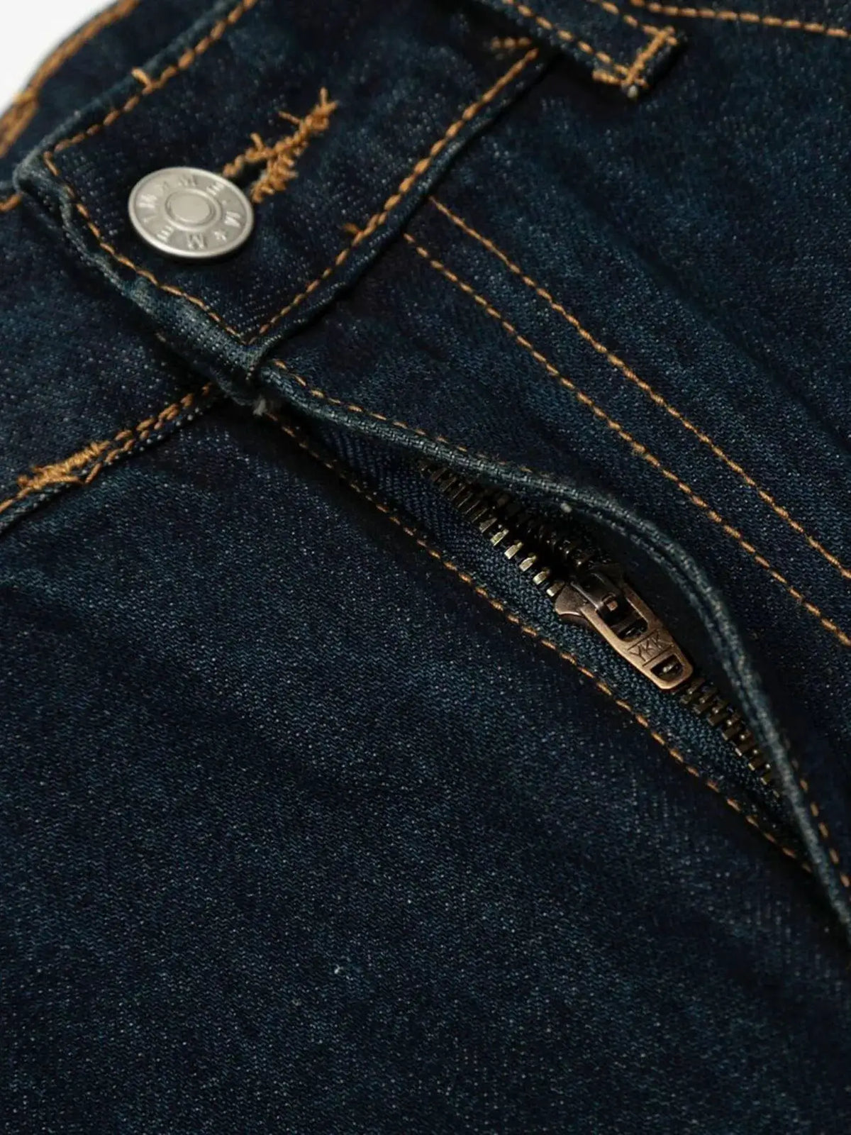 Oversized men's wide-leg denim shorts, 100% cotton, dark indigo with orange topstitching and metal zipper.