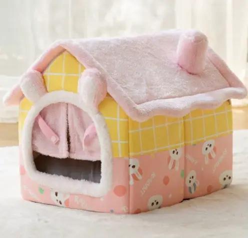 Foldable dog house and cat bed in plush pink and yellow, enclosed cave style with removable nest.