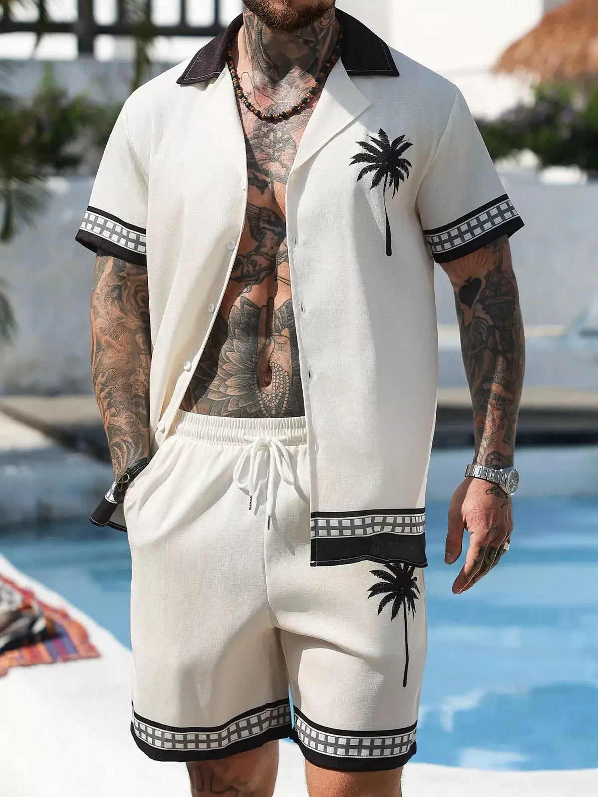 Men's tropical palm tree print short-sleeve shirt and shorts set in white with black accents by Trendsi