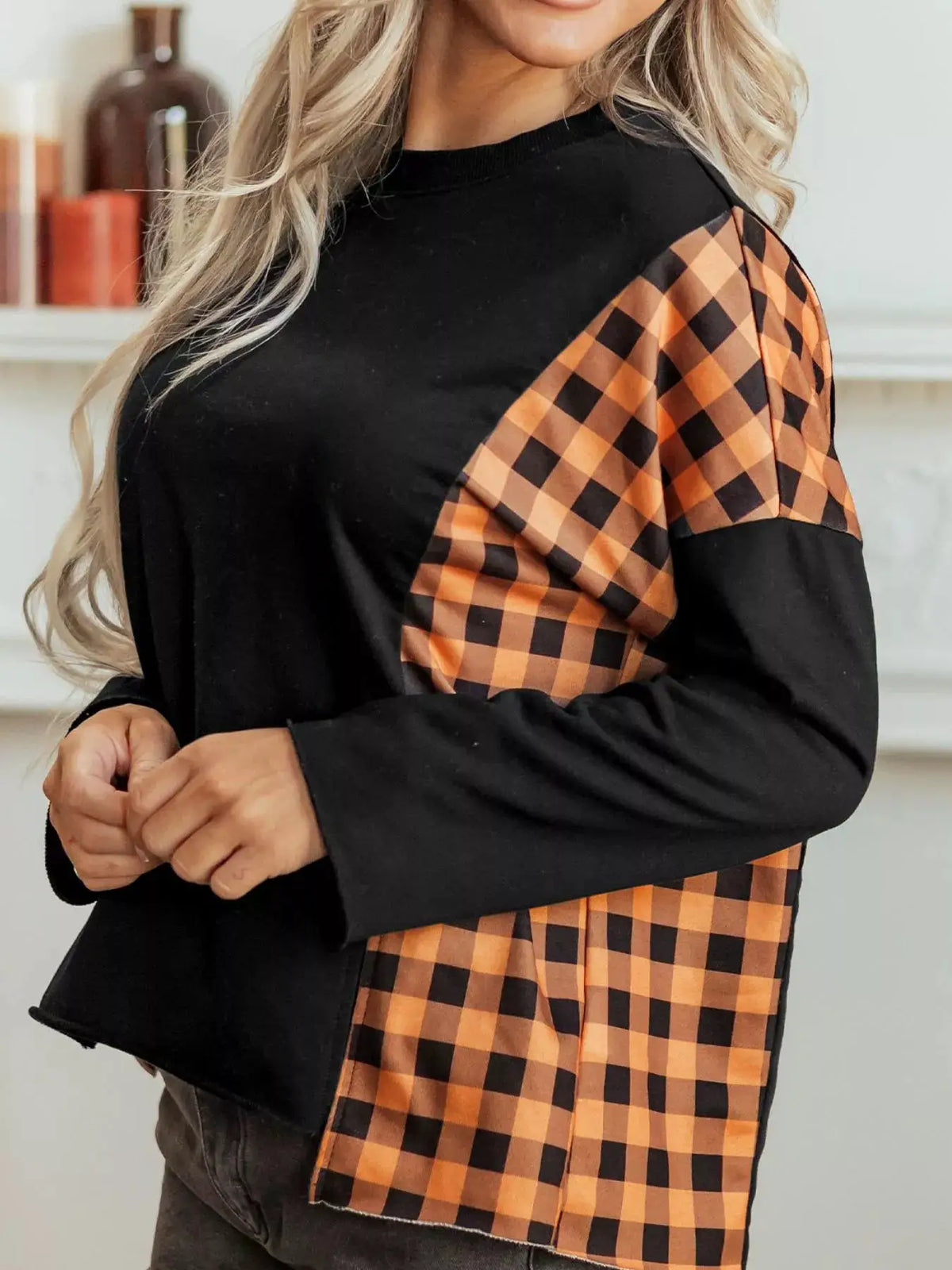 Patchwork Plaid Pumpkin Face Long Sleeve Top by Trendsi, black body with orange plaid side panels