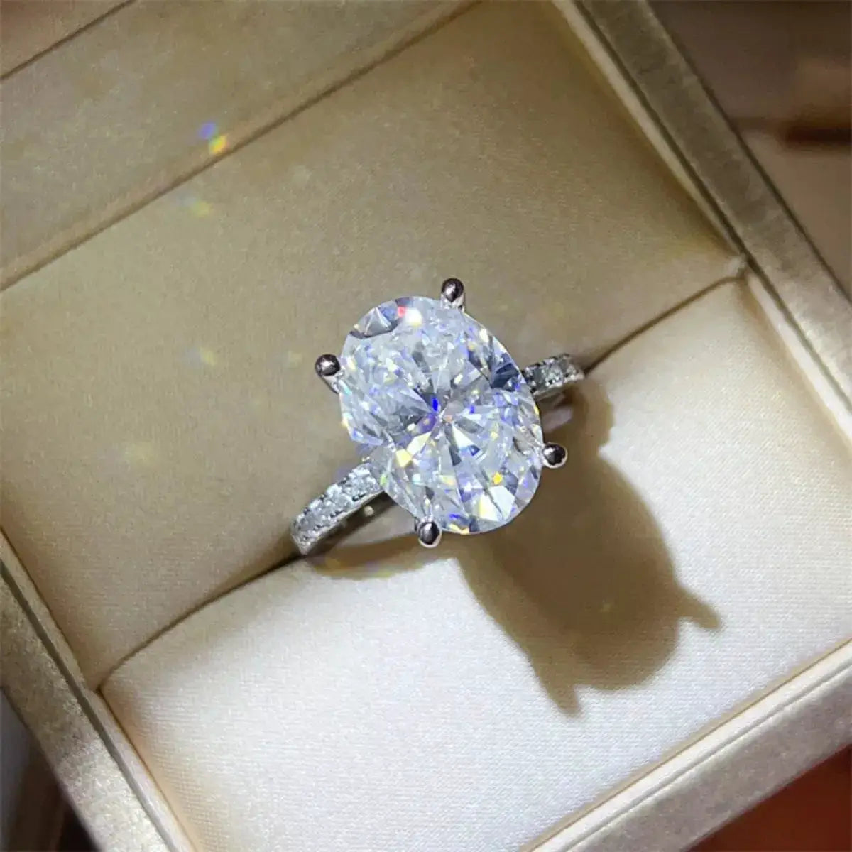 8 Carat Moissanite Ring in 925 Sterling Silver with an oval center stone and pave-set band